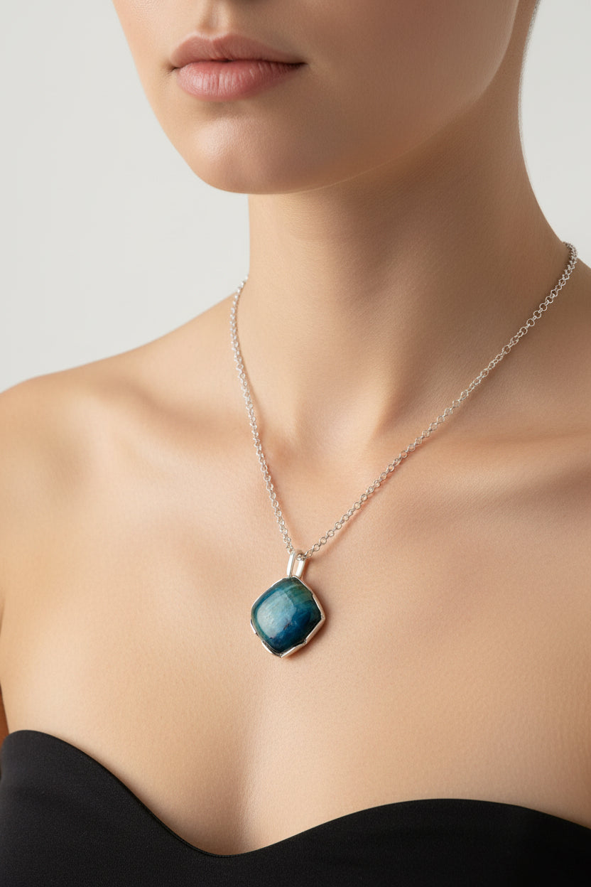 Blue pendant necklace on a black background